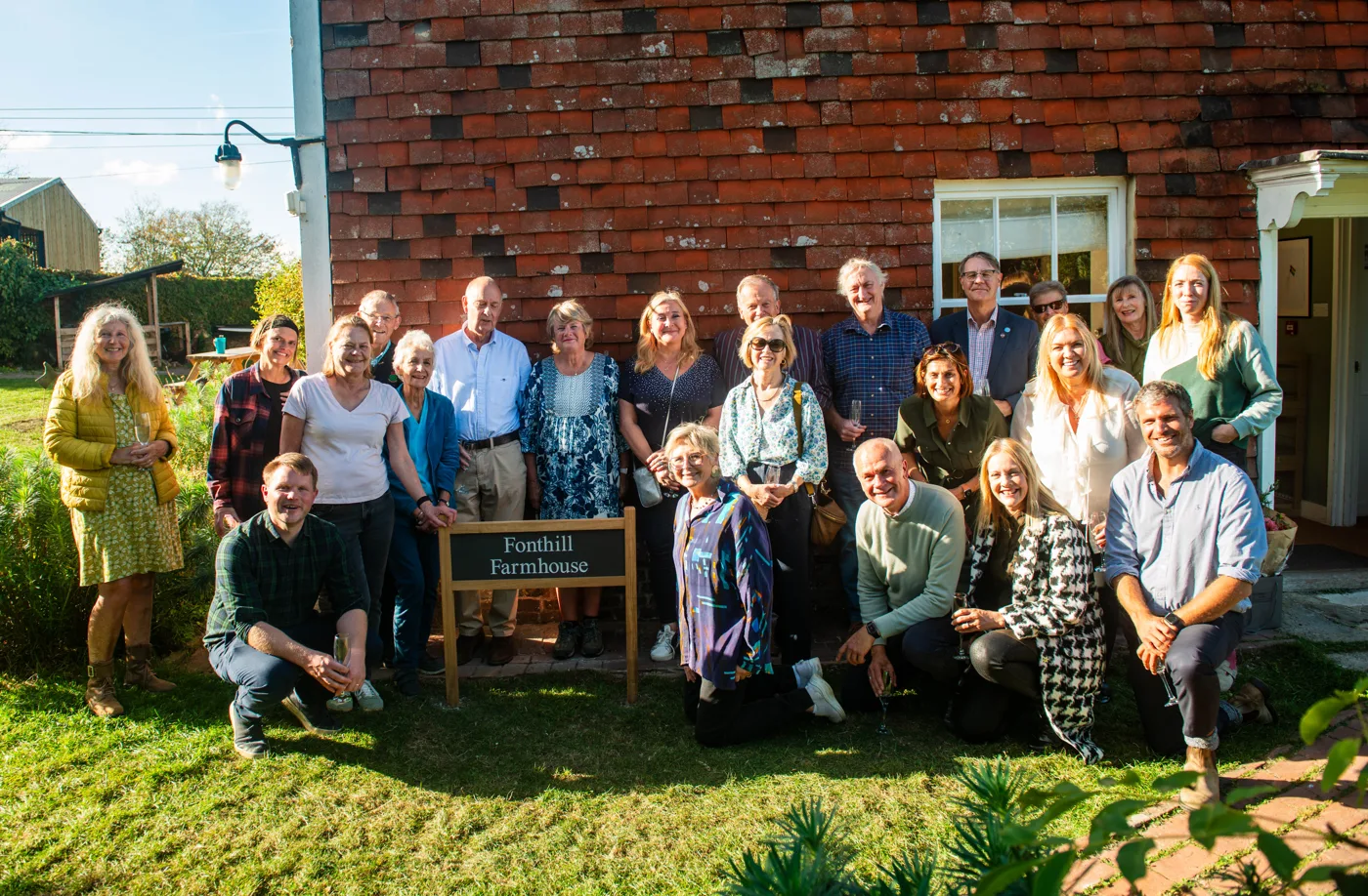 Jamie's Farm and Fonthill Foundation trustees, staff and guests around the new Fonthill Farmhouse sign at Allington Farm.